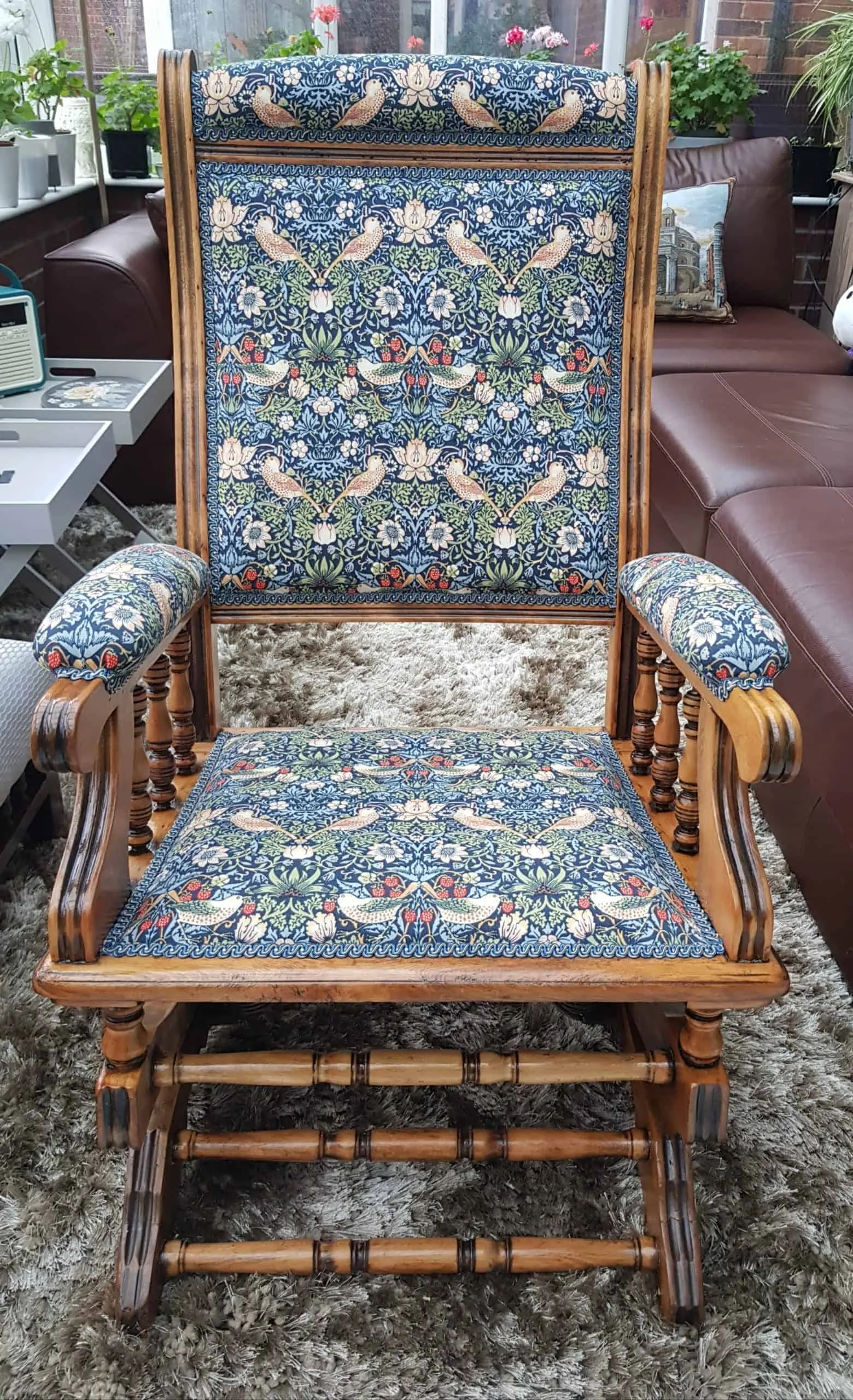 Victorian armchair after re-upholstery in a William Morris print