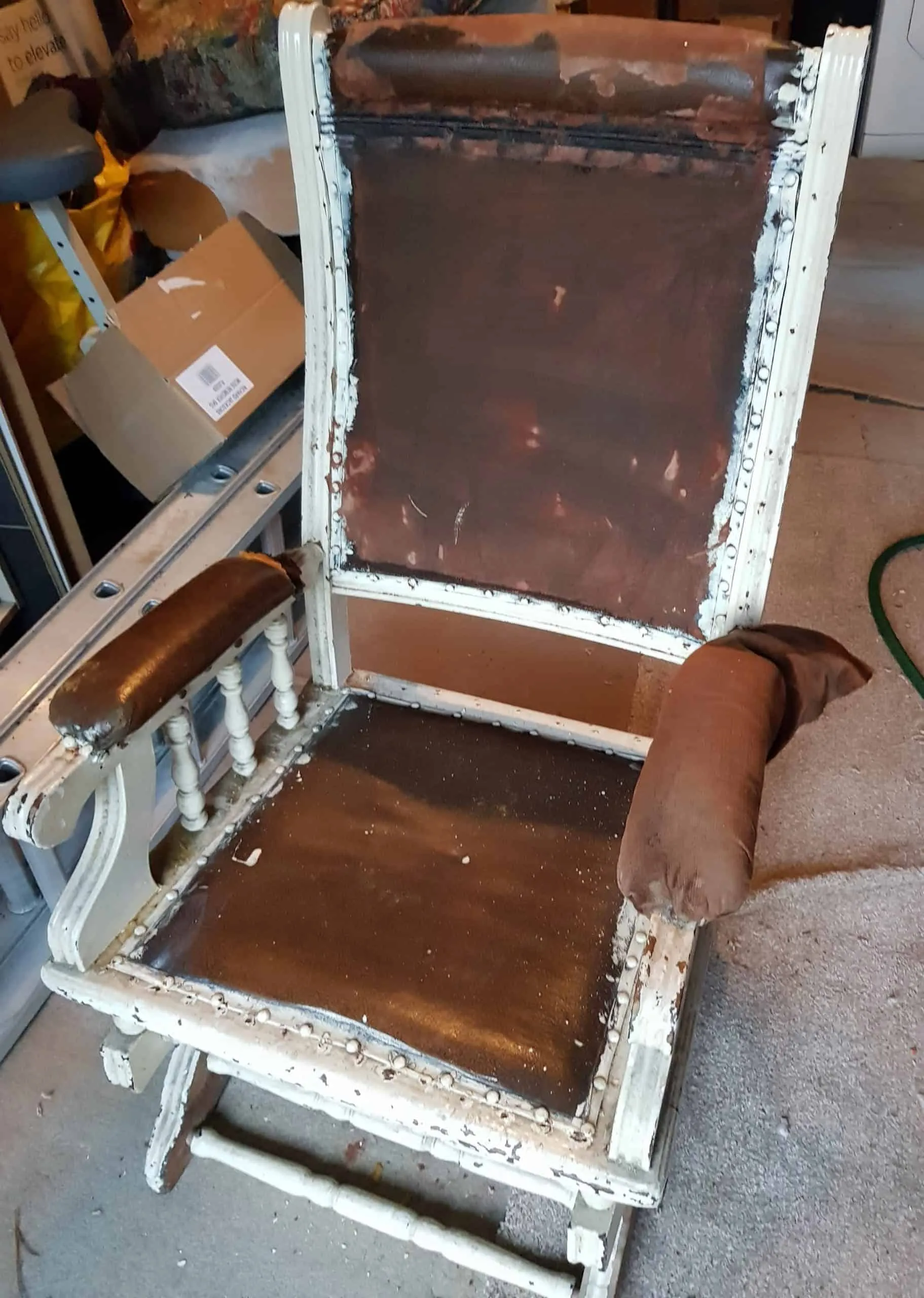 The same armchair before, stripped and worn