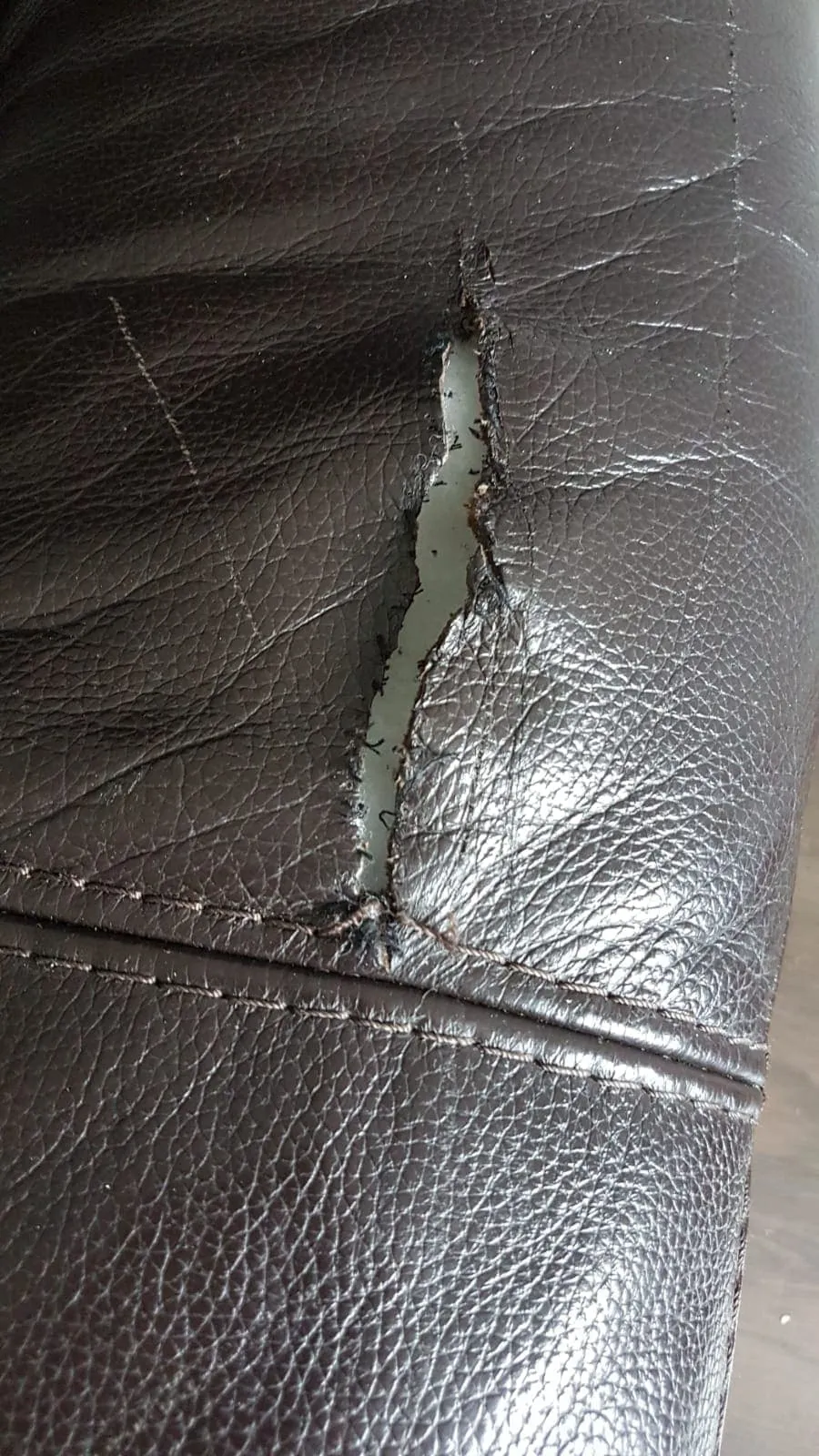 Split leather repaired, before