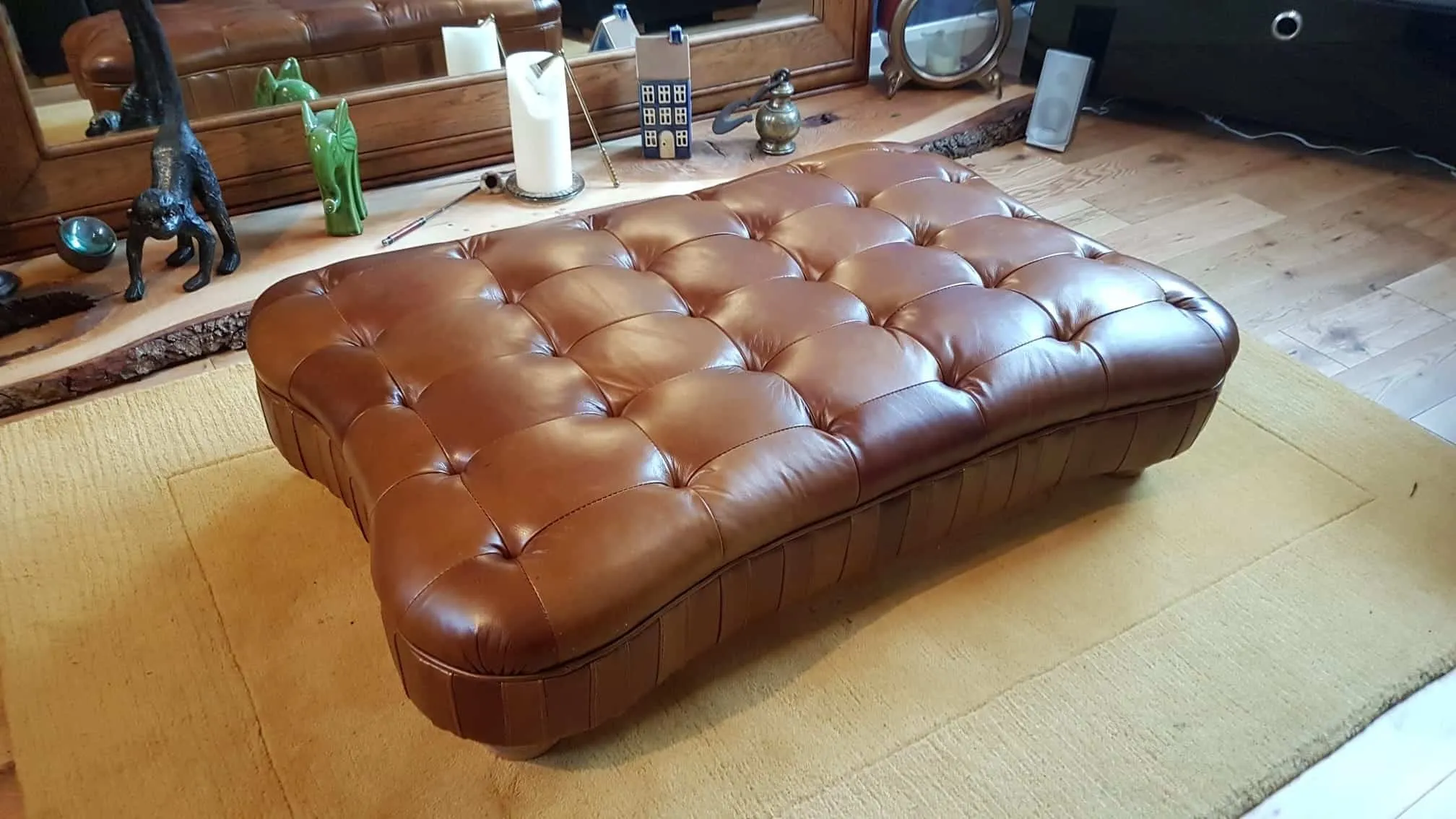 Buttoned leather footstool, after